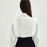 Women's boxy shirt with multiple buttons